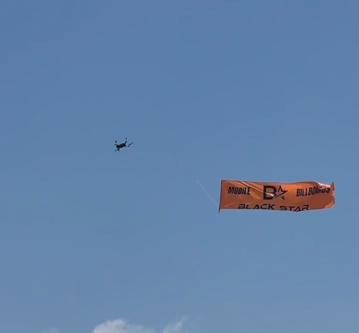Flying Banners Pulled By Drones Mobile Billboards by Black Star Advertising