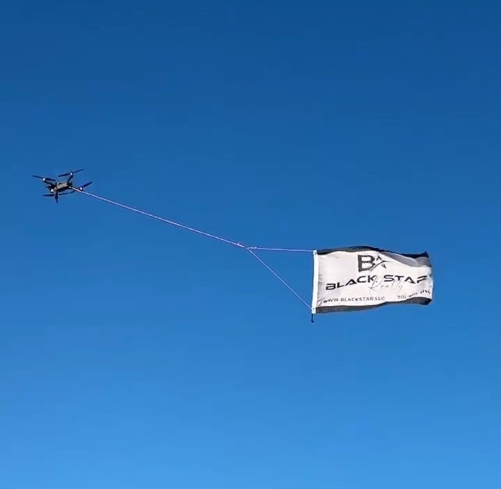 Flying Banners Pulled By Drones Mobile Billboards by Black Star Advertising